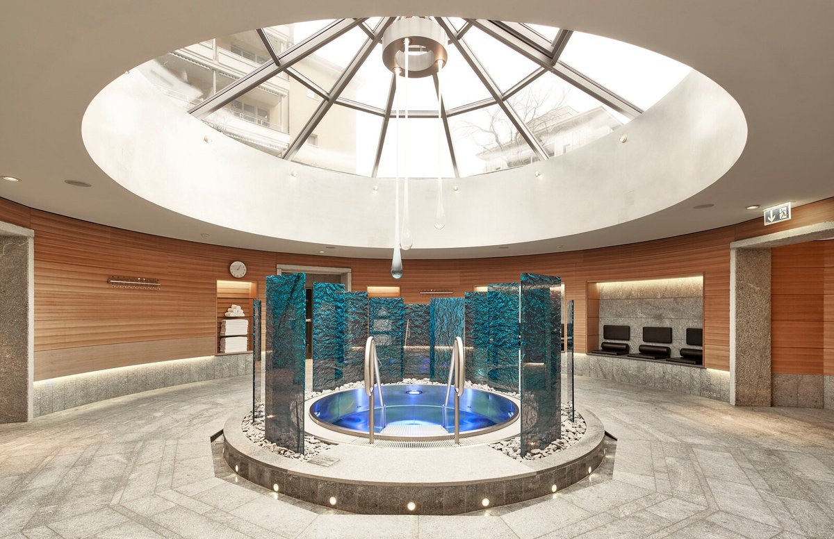 Grand Resort Bad Ragaz spa plunge pool — glass-domed thermal Tauchbecken with turquoise water features